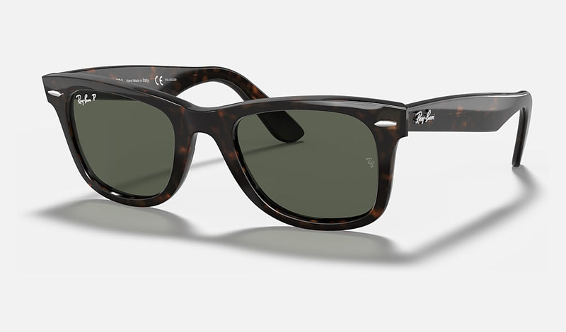 Ray-Ban Wayfarer Classic sunglasses in various colors with polarized and gradient lenses, featuring acetate frames and iconic logo.